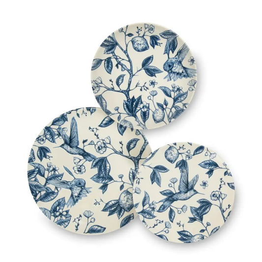 Set of three ceramic coasters with blue floral and bird pattern on a white background