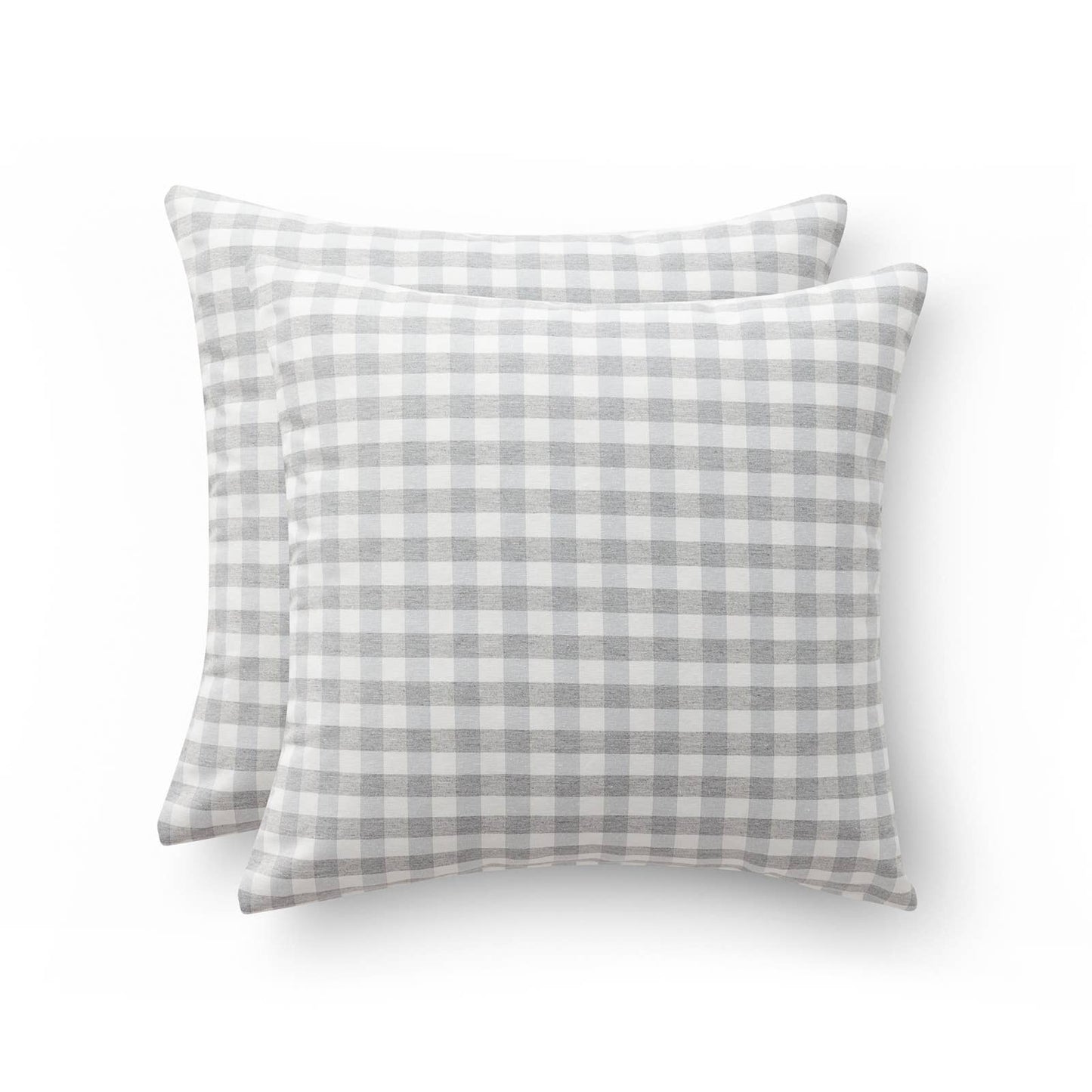Two gray and white checkered pillows on a white background