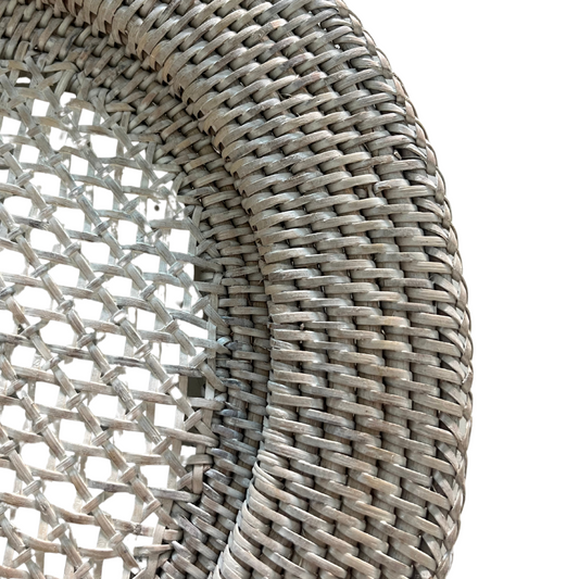 Close-up of eco-friendly handwoven rattan texture in deep white finish