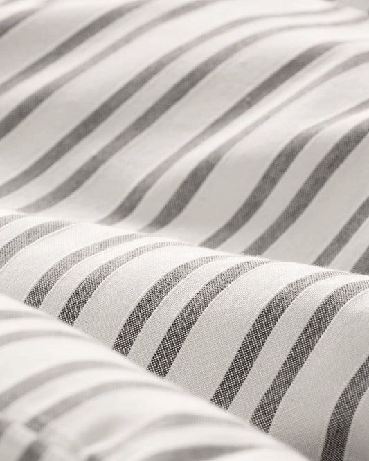 Close-up of the taupe jacquard weave showing the real cotton soft feel.