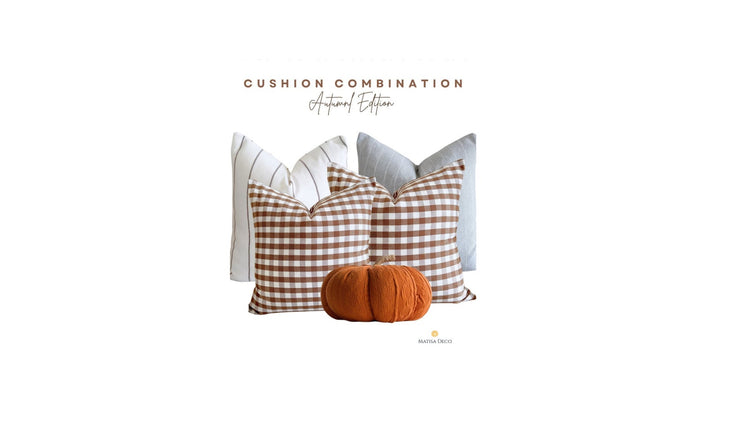 Autumn cushion combination in warm earthy tones styled on a sofa | Matisa Deco