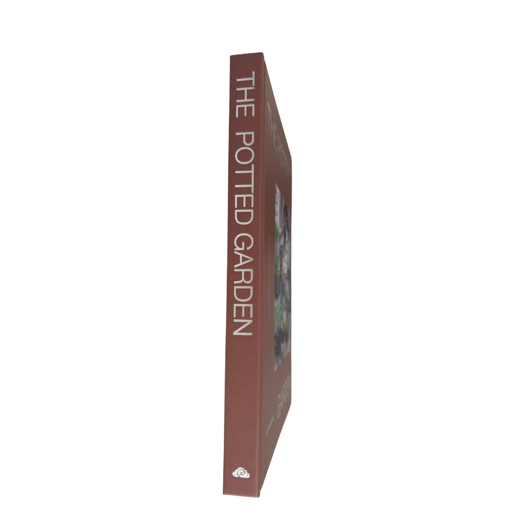 A book titled 'THE POTTED GARDEN' shown standing upright on its spine against a plain white background.