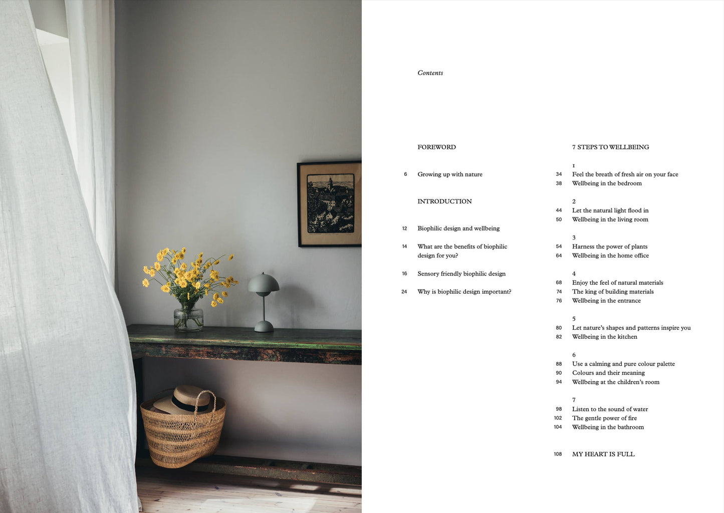 Room interior with a table, basket, and vase of flowers, alongside a book with text on a white background.
