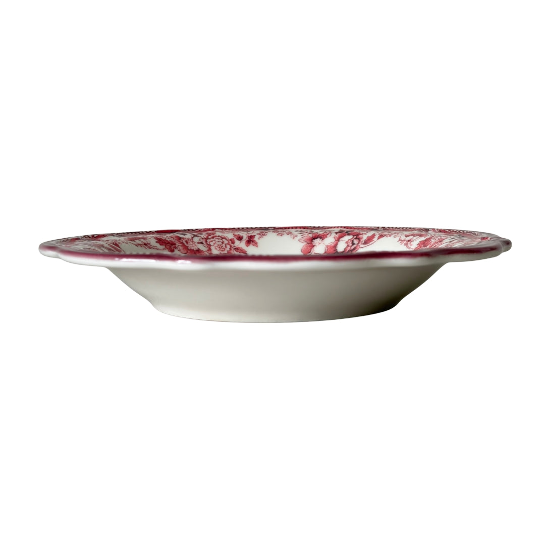 The 22cm deep plate stacked with the 26cm dinner plate, showing the rich red and pink floral harmony