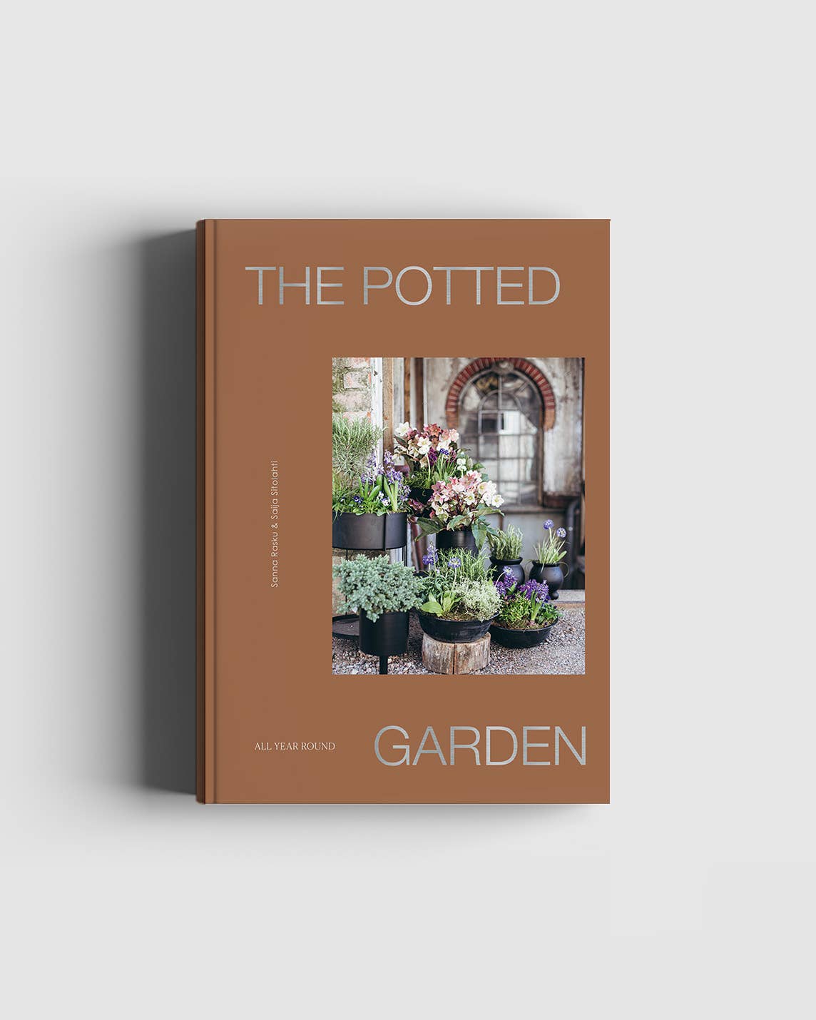 Book titled 'The Potted Garden' with a cover photo of potted plants on a light gray background