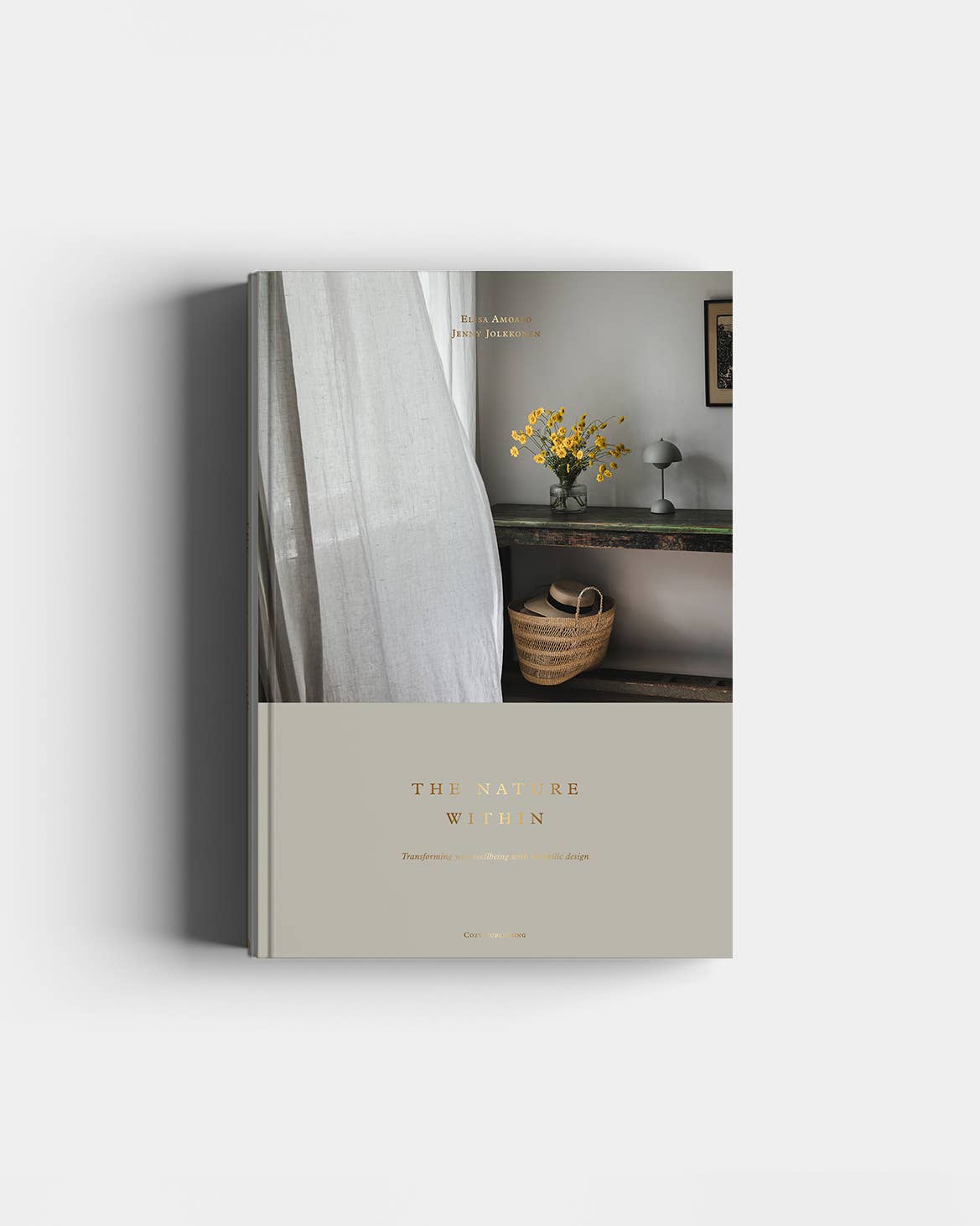 Book titled 'The Nature of Women' with a cover featuring a room interior.