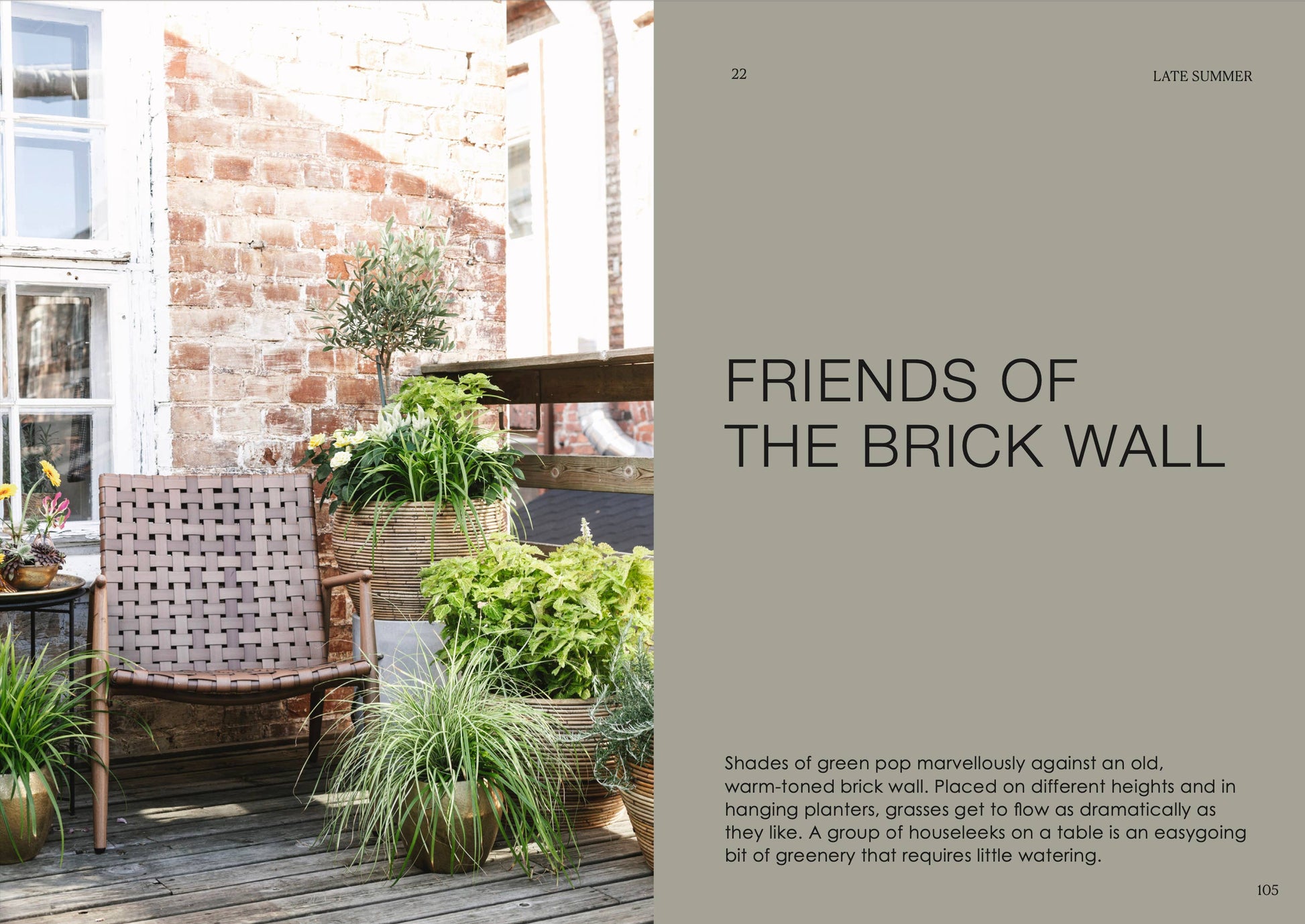 Outdoor patio with brick wall, wooden chair, and potted plants.