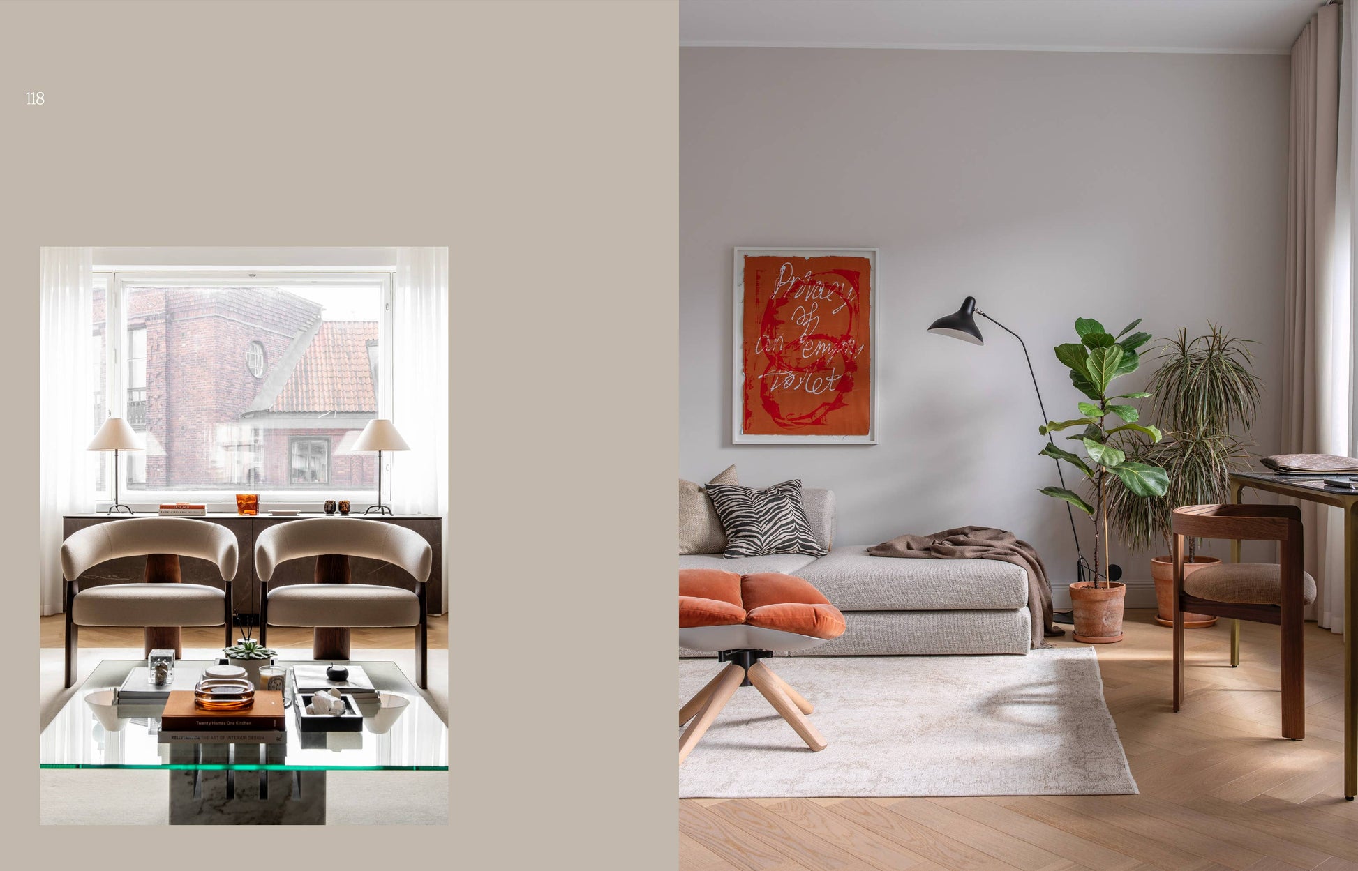 Modern living room with gray sofa, glass coffee table, and artwork on the wall.