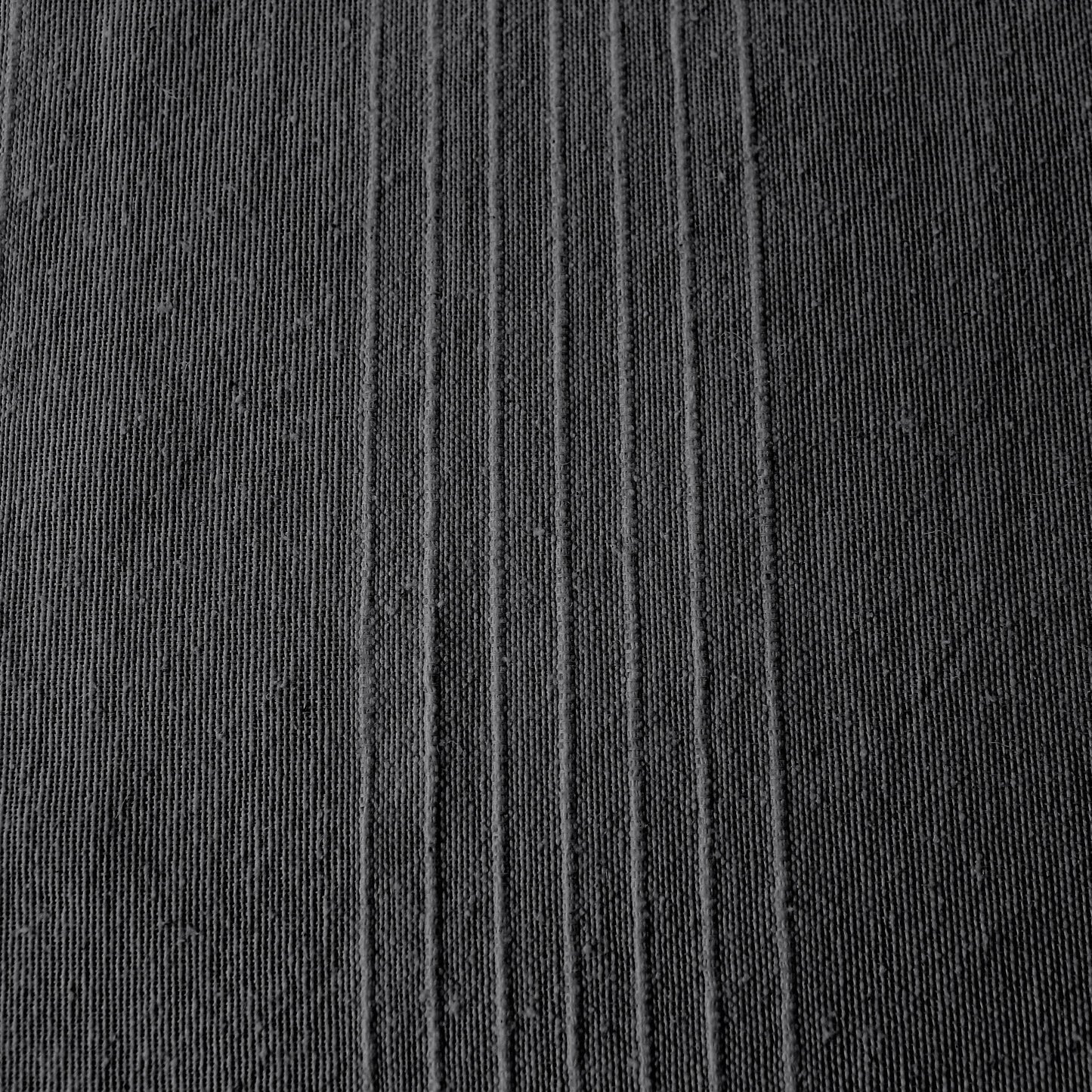 Close-up of coastal anthracite Carbon Black ribbed cotton texture