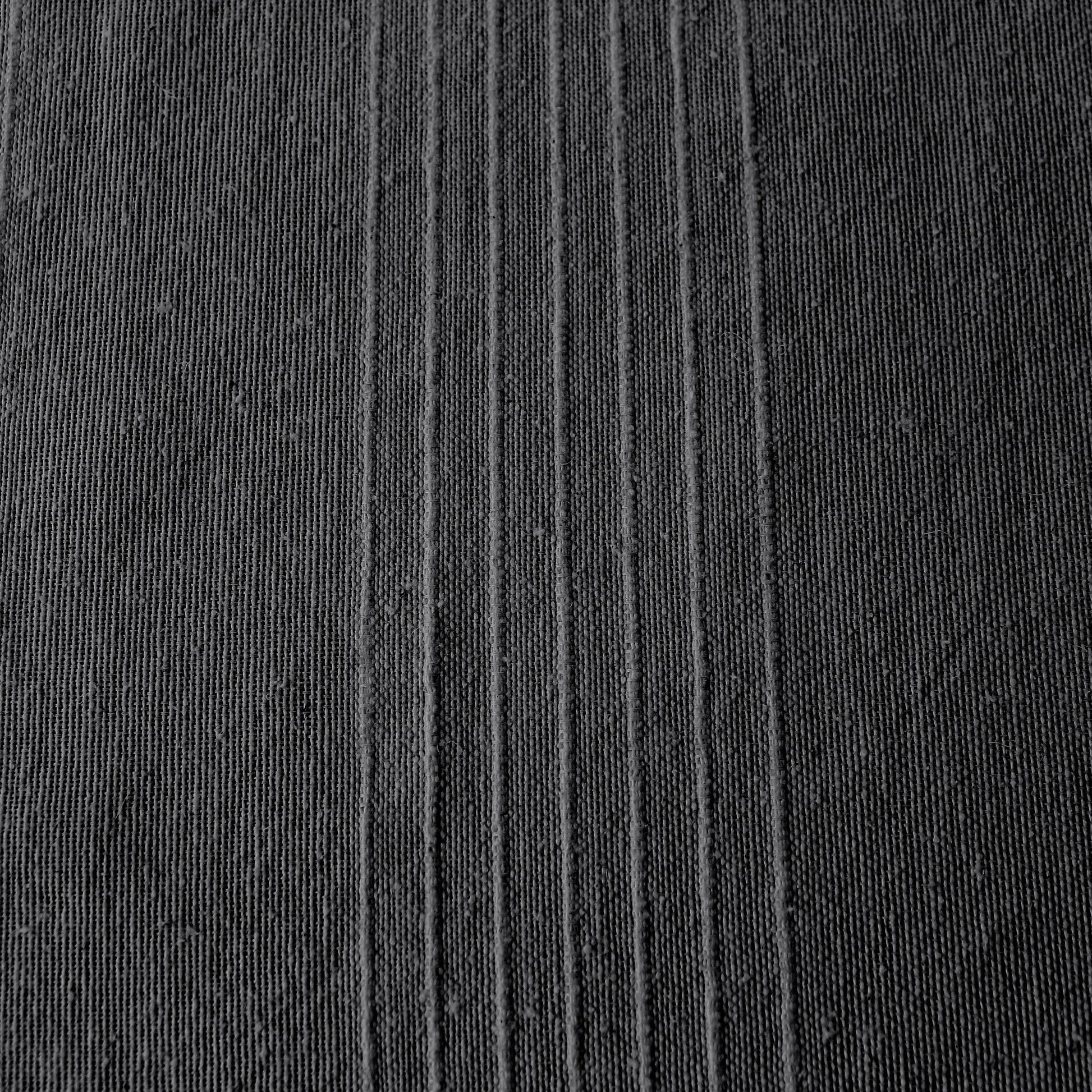 Close-up of coastal anthracite Carbon Black ribbed cotton texture