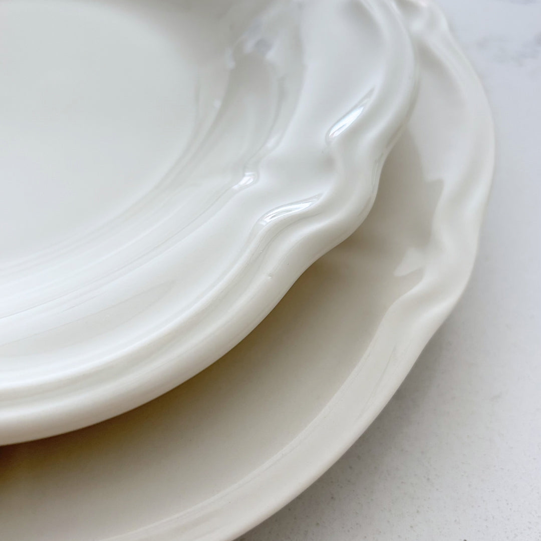 Close up of the gloss chalk white finish on the Charlotte professional grade stoneware plate showing scratch resistance.