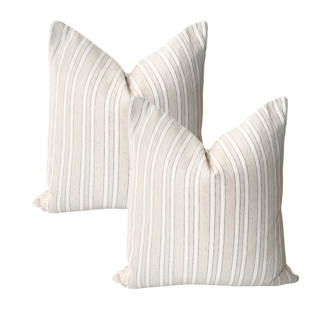 Set of two taupe woven jacquard cushion covers 45x45 cm with elegant raised decorative finish on a white background.