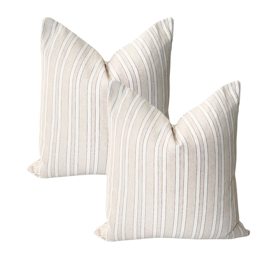 Set of two taupe woven jacquard cushion covers 45x45 cm with elegant raised decorative finish on a white background.