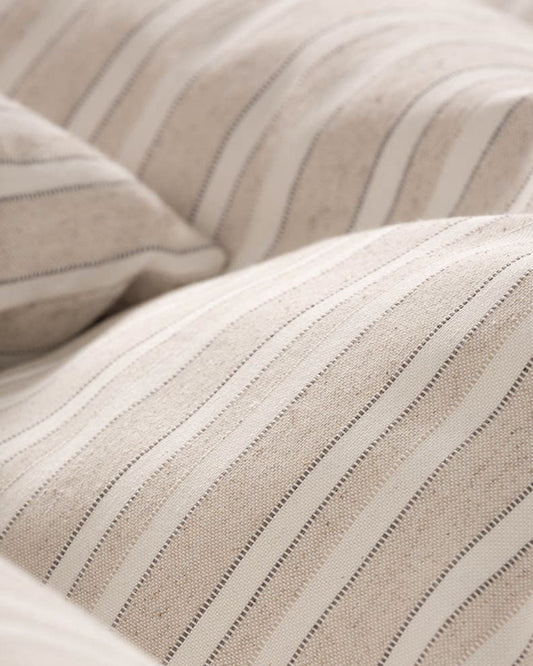 Premium taupe jacquard weave showing the depth and character of the raised decorative finish and real cotton feel.