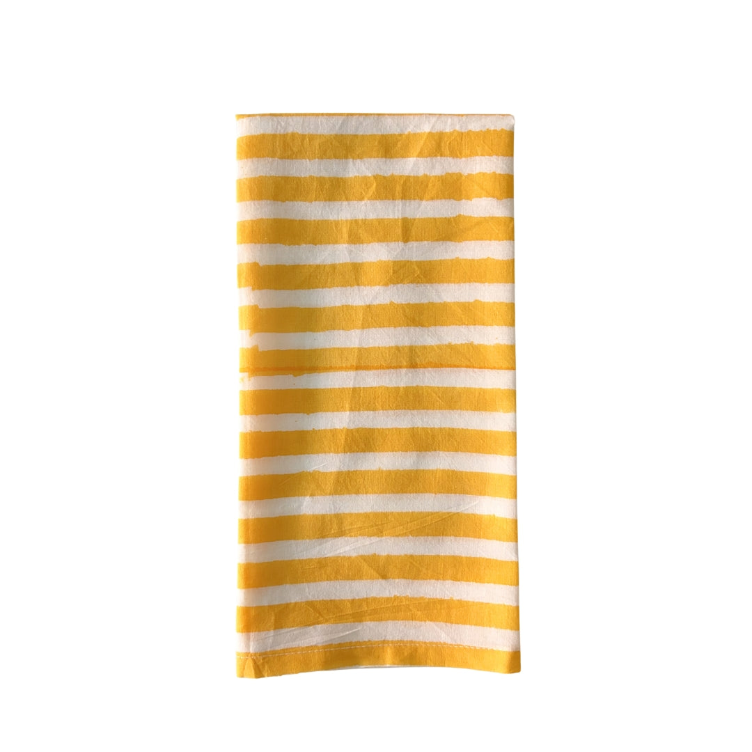 Yellow and white striped napkin on a white background