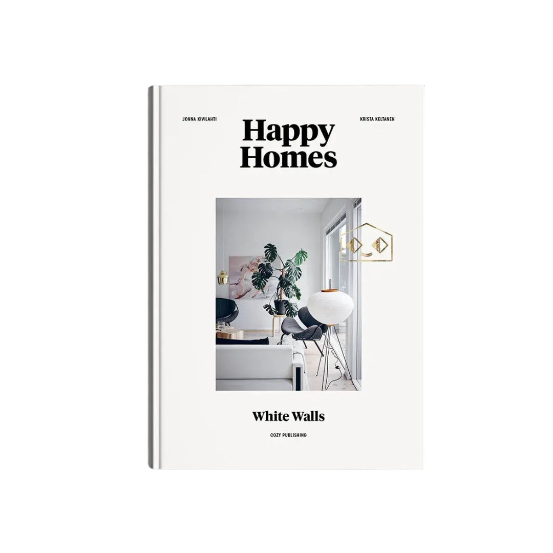 A hardcover book titled 'Happy Homes White Walls' by John Richards and Kevin Hennes, featuring a minimalist white cover with a central interior design photograph.