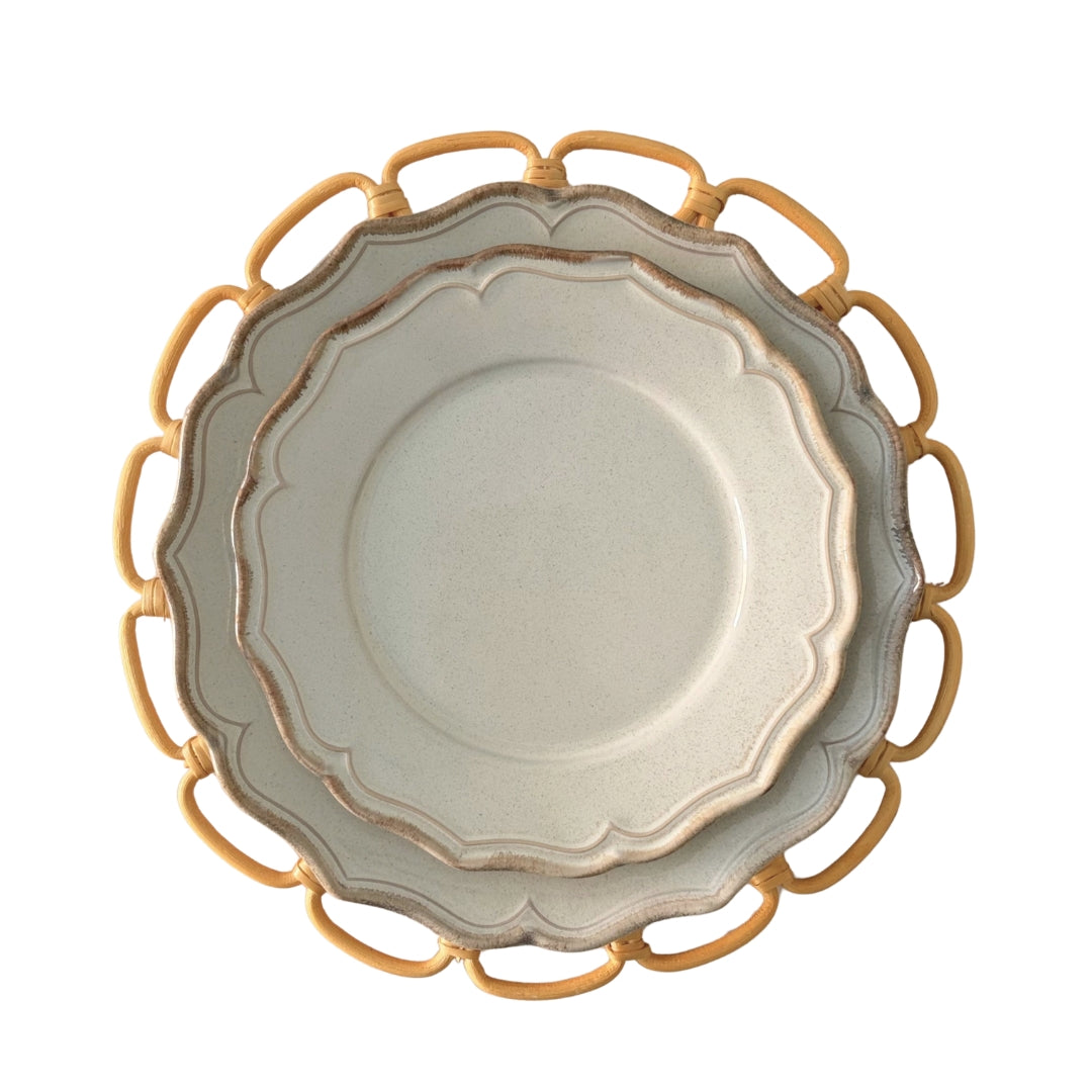 Beige stoneware dessert plate layered with matching French inspired tableware