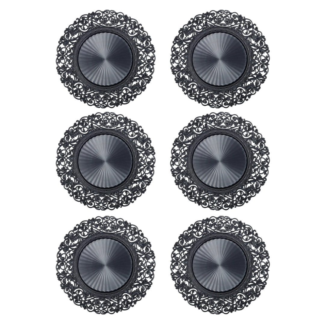 Set of six black Baroque charger plates with intricate ornamental detailing