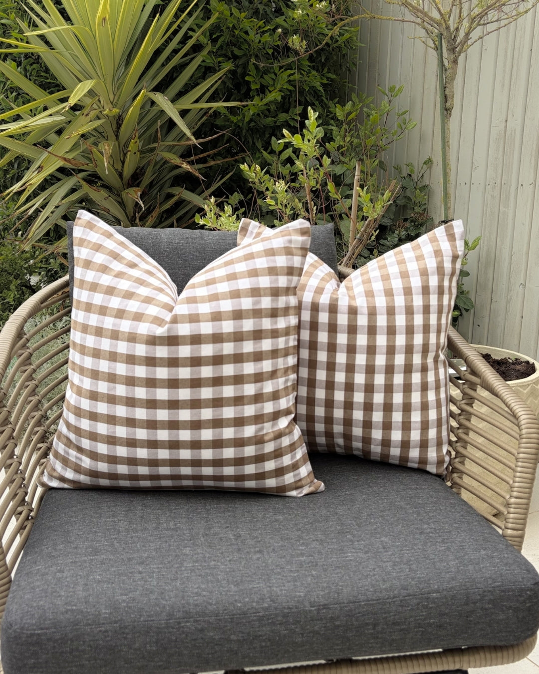 Brown splash-proof cushions on wooden patio furniture.