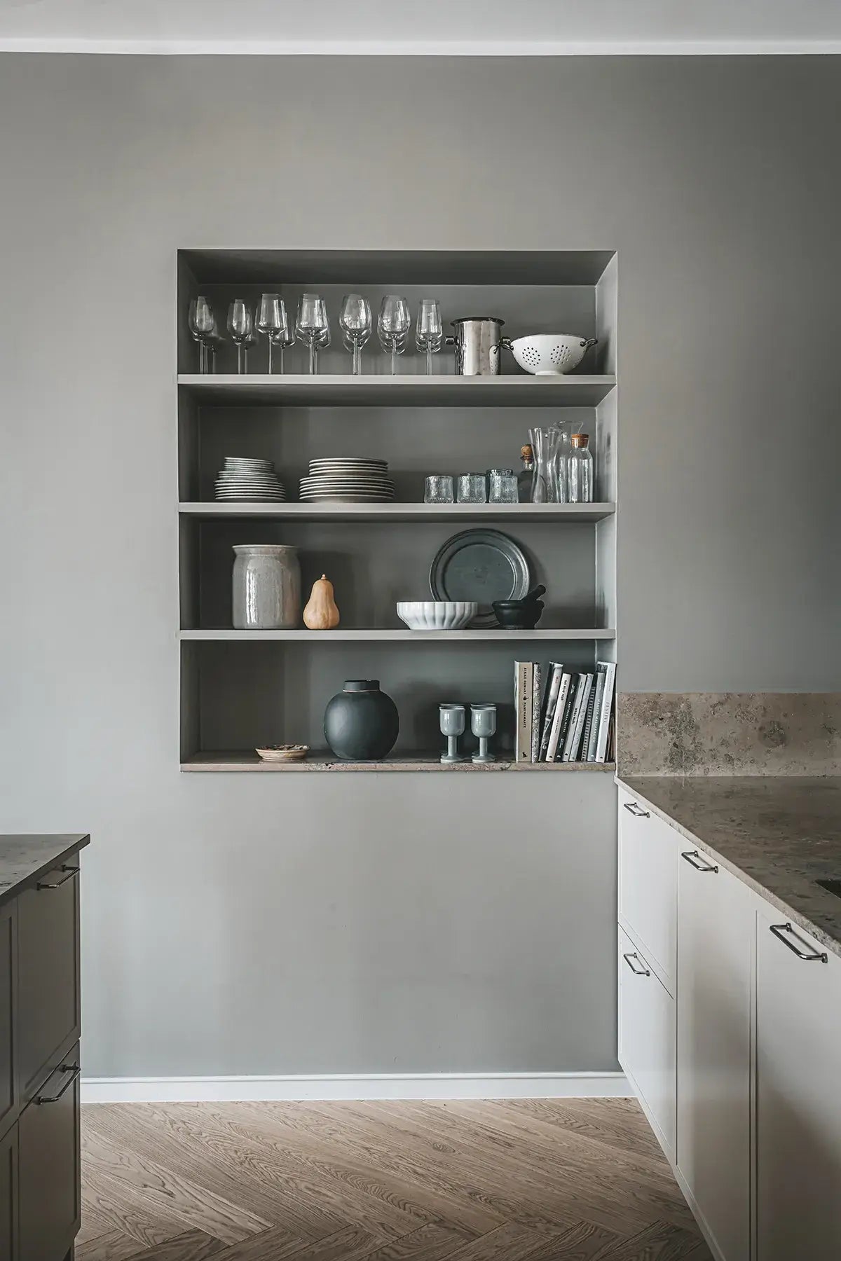 Shelving unit with kitchenware in a modern kitchen setting