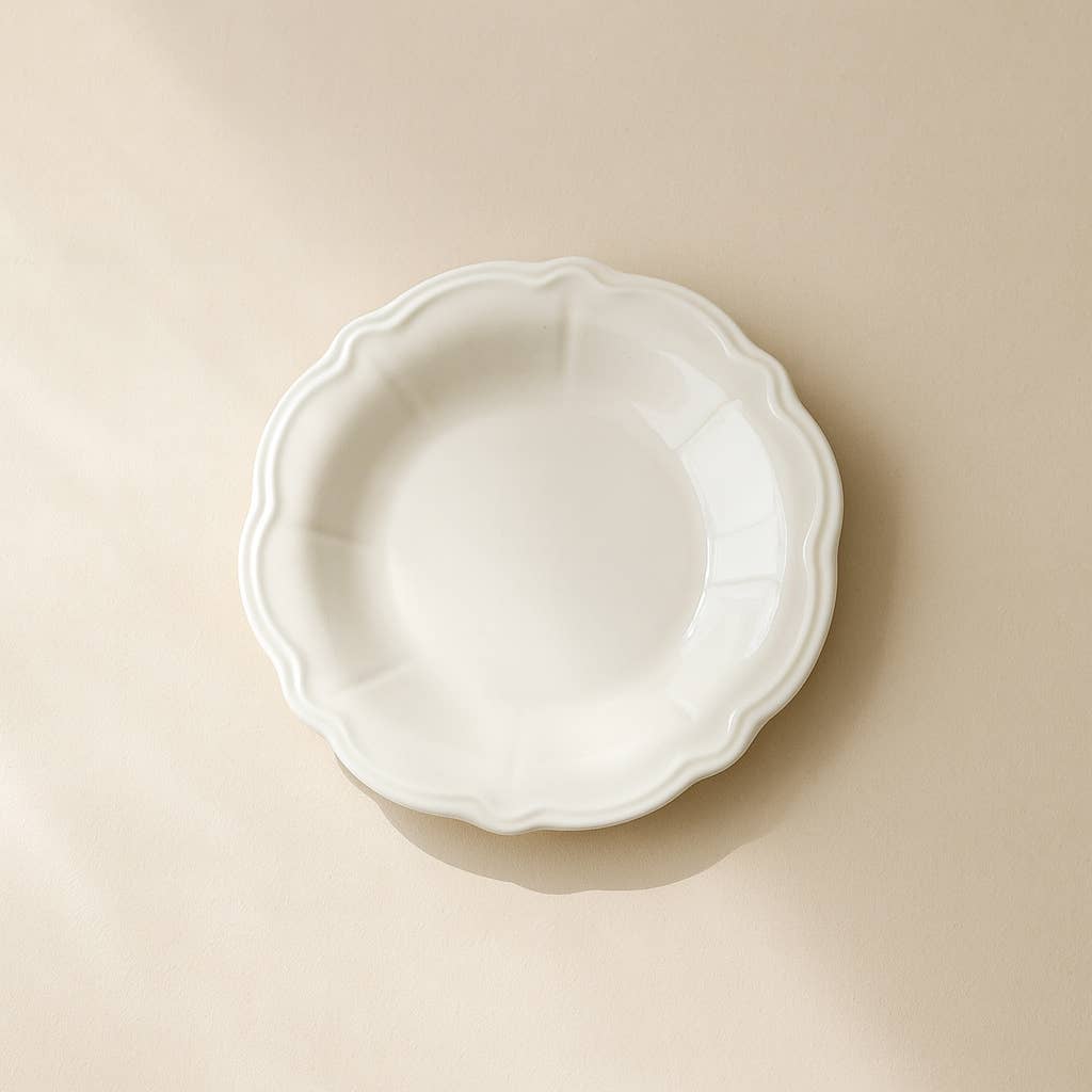 White ceramic pie dish on a beige background