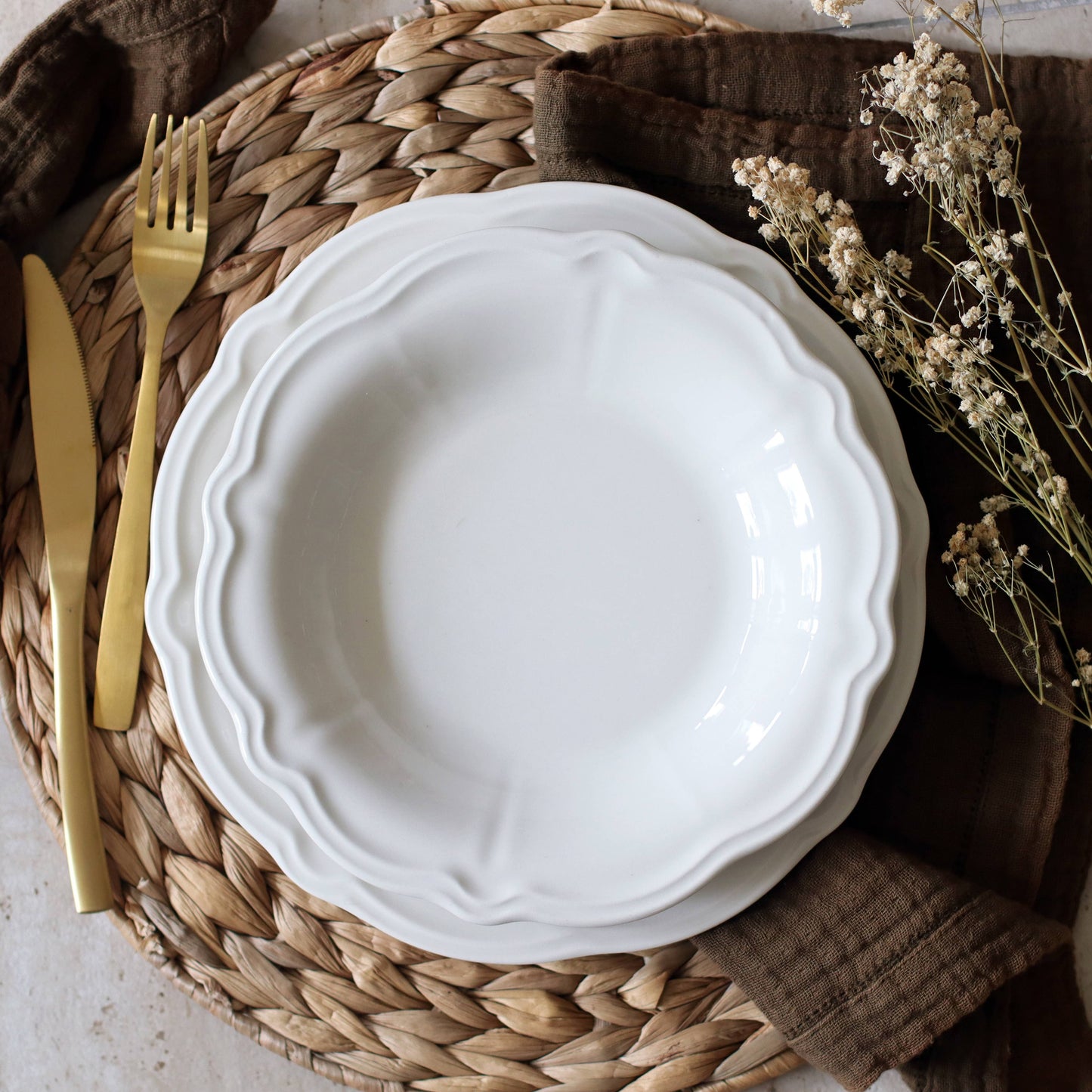 Elegant table setting for 6 people featuring Charlotte white ceramic dinnerware in a contemporary dining room.