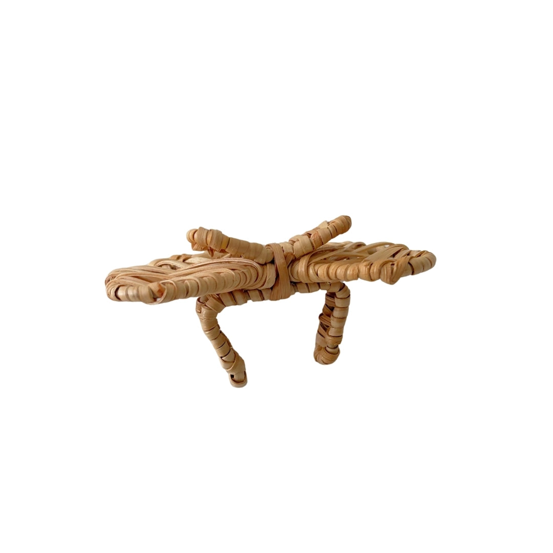 Side view of the Double Bow Rattan Napkin Ring showing its statement bow shape and napkin holder