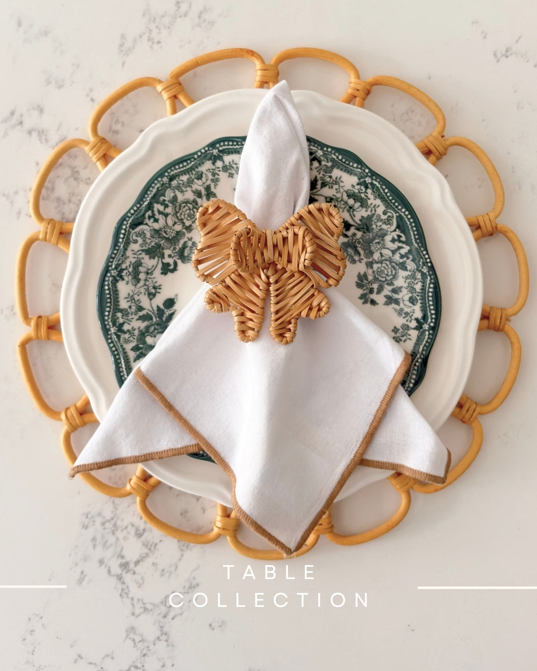 Close-up of a handwoven Double Bow Rattan Napkin Ring styled as natural table decor