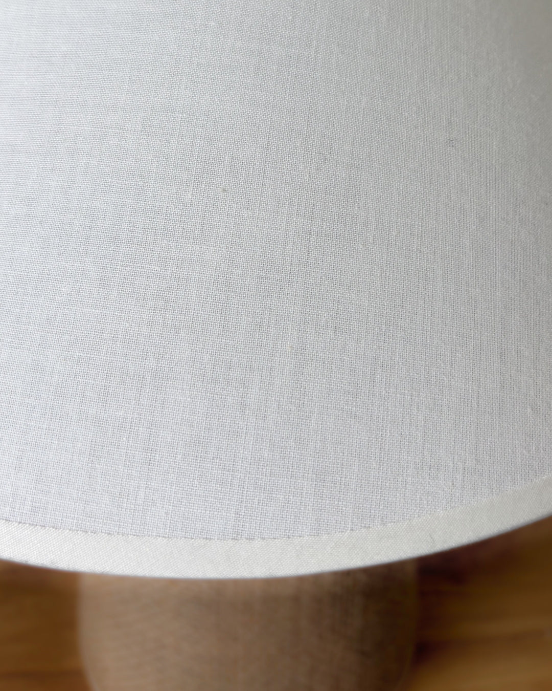 Top-down view of the Sculpt lamp's E27 socket and the high-quality interior finish of the cotton shade.