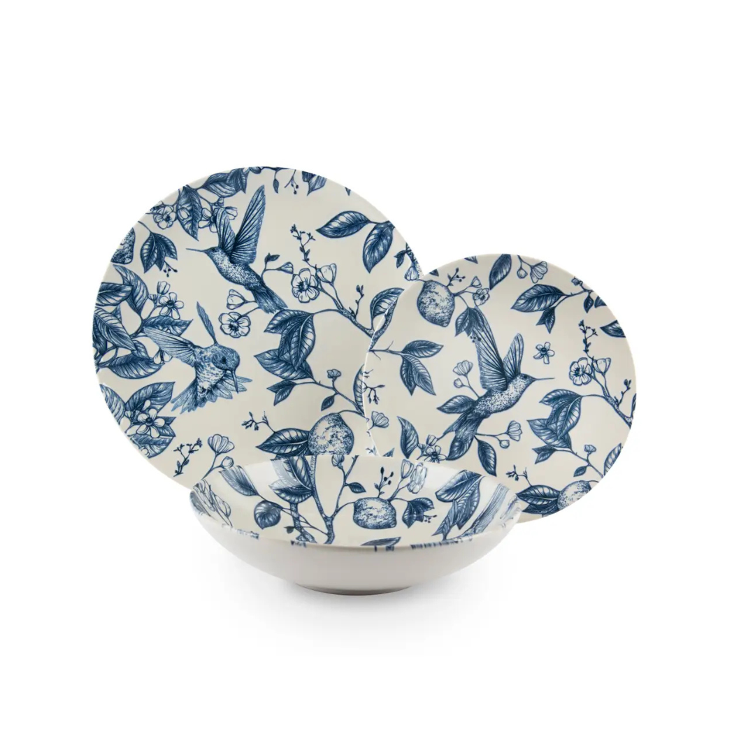 Excelsa Colibri 12-piece ceramic dinnerware set with blue hand-painted bird accents, as seen in InsideKent Magazine