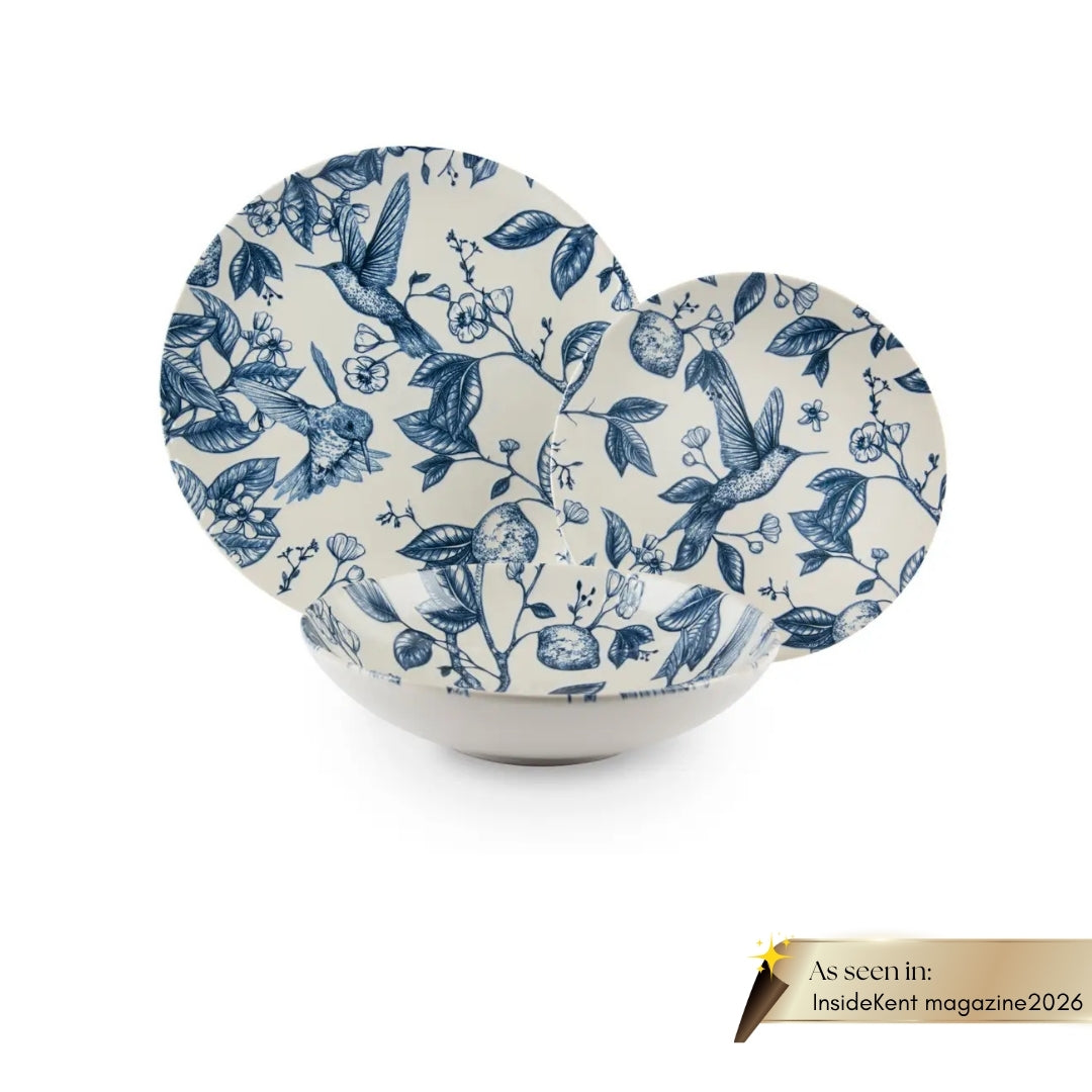 Excelsa Colibri 12-piece ceramic dinnerware set with blue hand-painted bird accents, as seen in InsideKent Magazine.