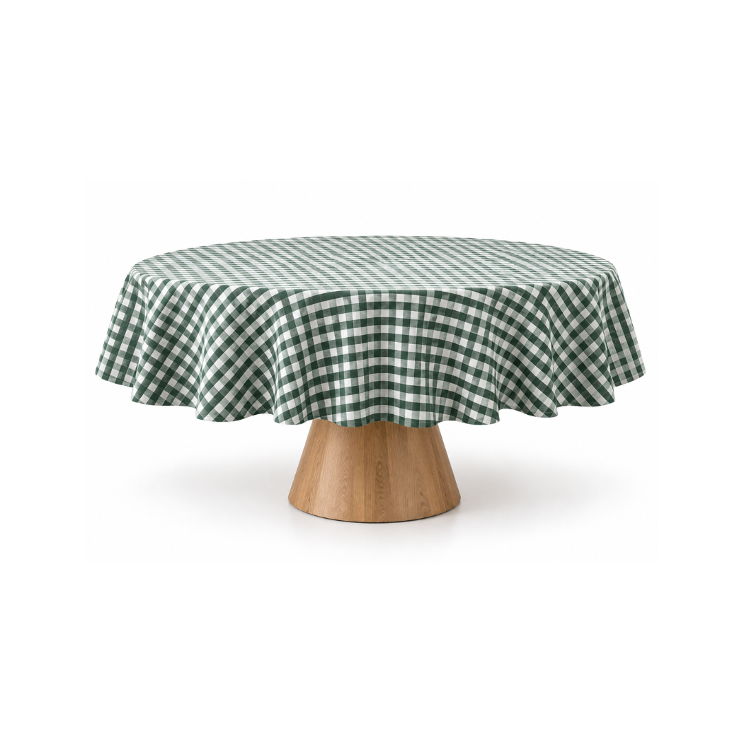 Green gingham round tablecloth styled on a wooden pedestal dining table