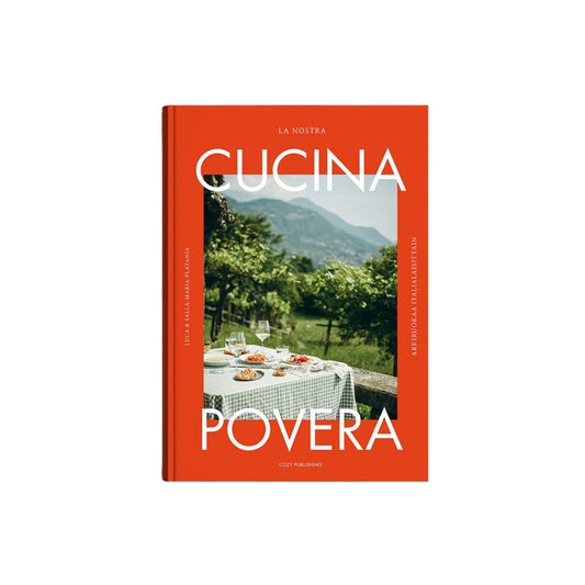 The cookbook 'La Nostra Cucina Povera' by Giulio Majoli and Silvia Rombaldi, published by Conti Panini. The book features a vibrant orange-red cover with a central photograph of a vineyard and dining table, and bold white typography.