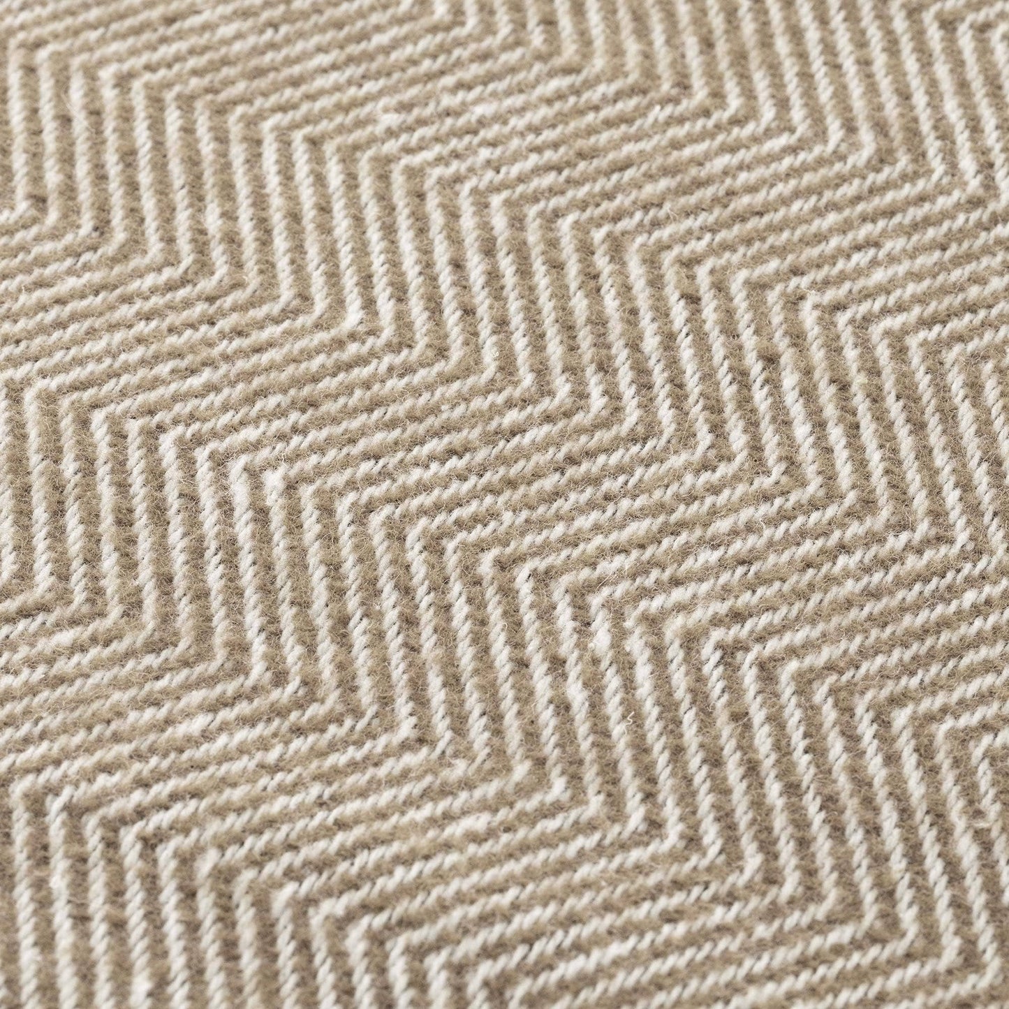 Close-up of the light brown and flax natural cotton fabric, showing the breathable weave of the NATURE collection.