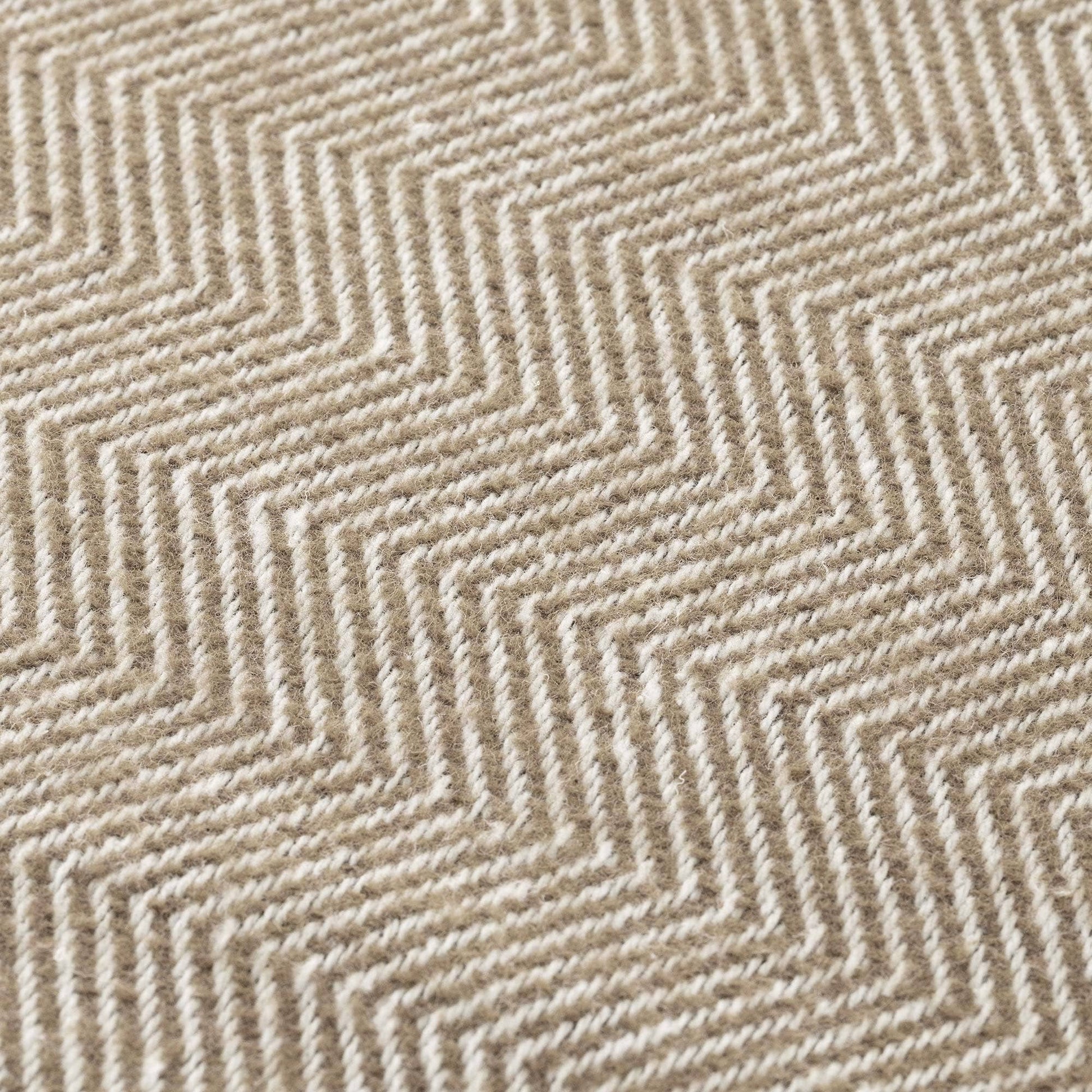 Close-up of the light brown and flax natural cotton fabric, showing the breathable weave of the NATURE collection.