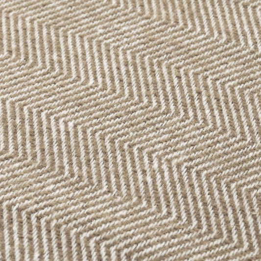 Close-up of the light brown and flax natural cotton fabric, showing the breathable weave of the NATURE collection.