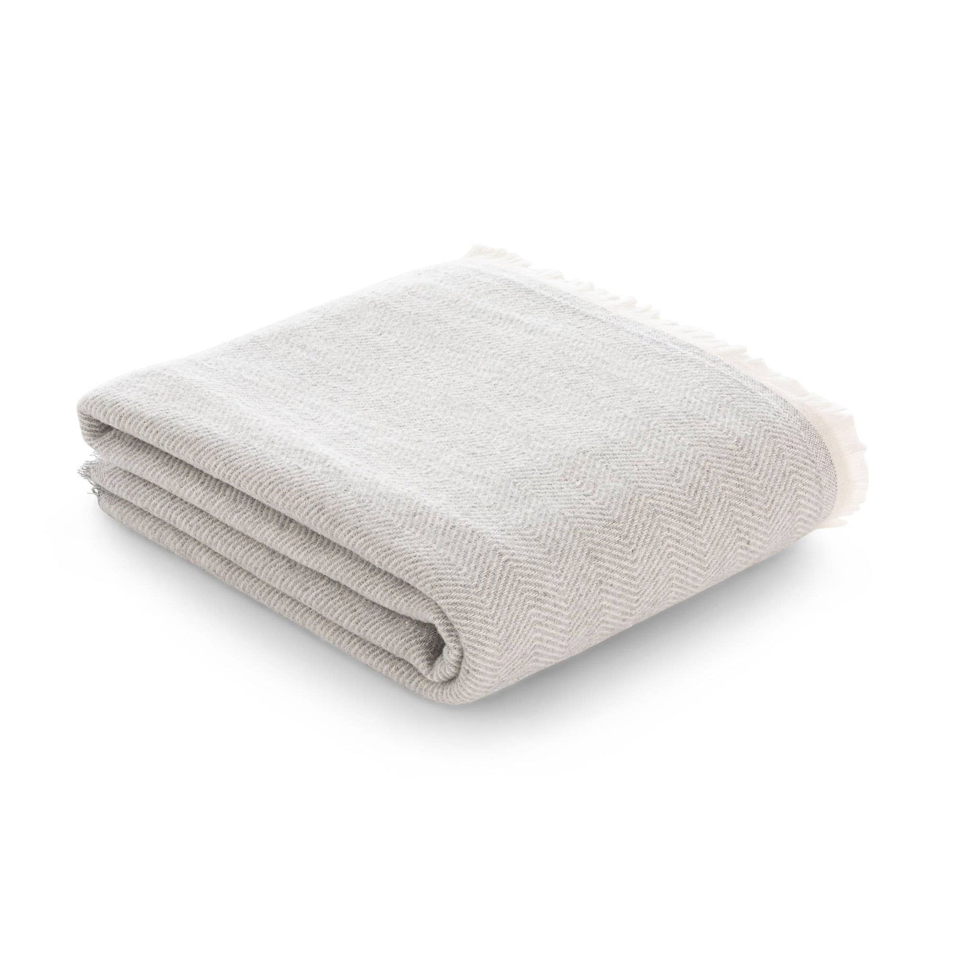 NATURE artisan fringed throw blanket in light grey, made with soft natural cotton.