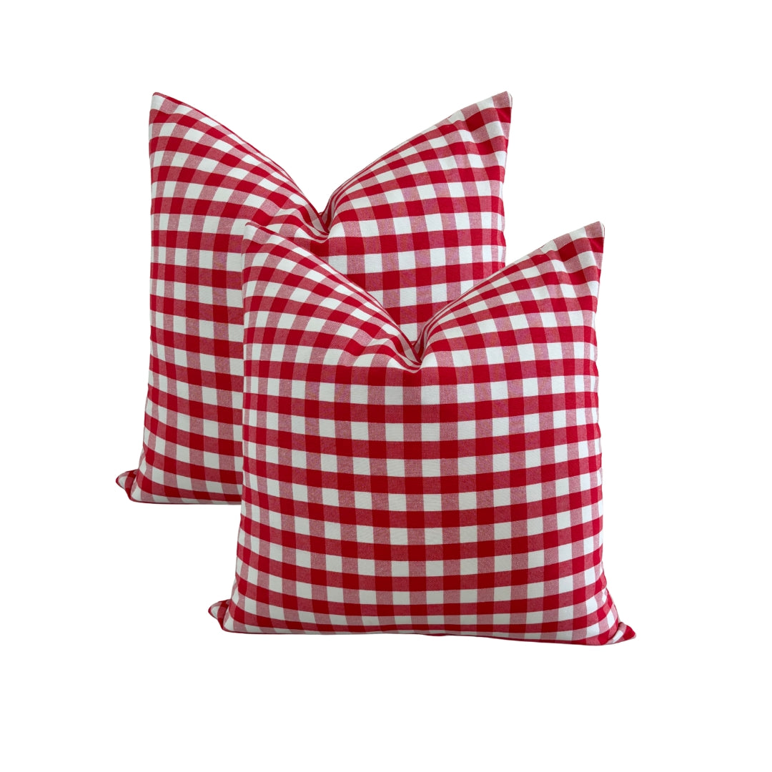 Demonstration of splash-proof water repellent finish on red gingham cushion cover.