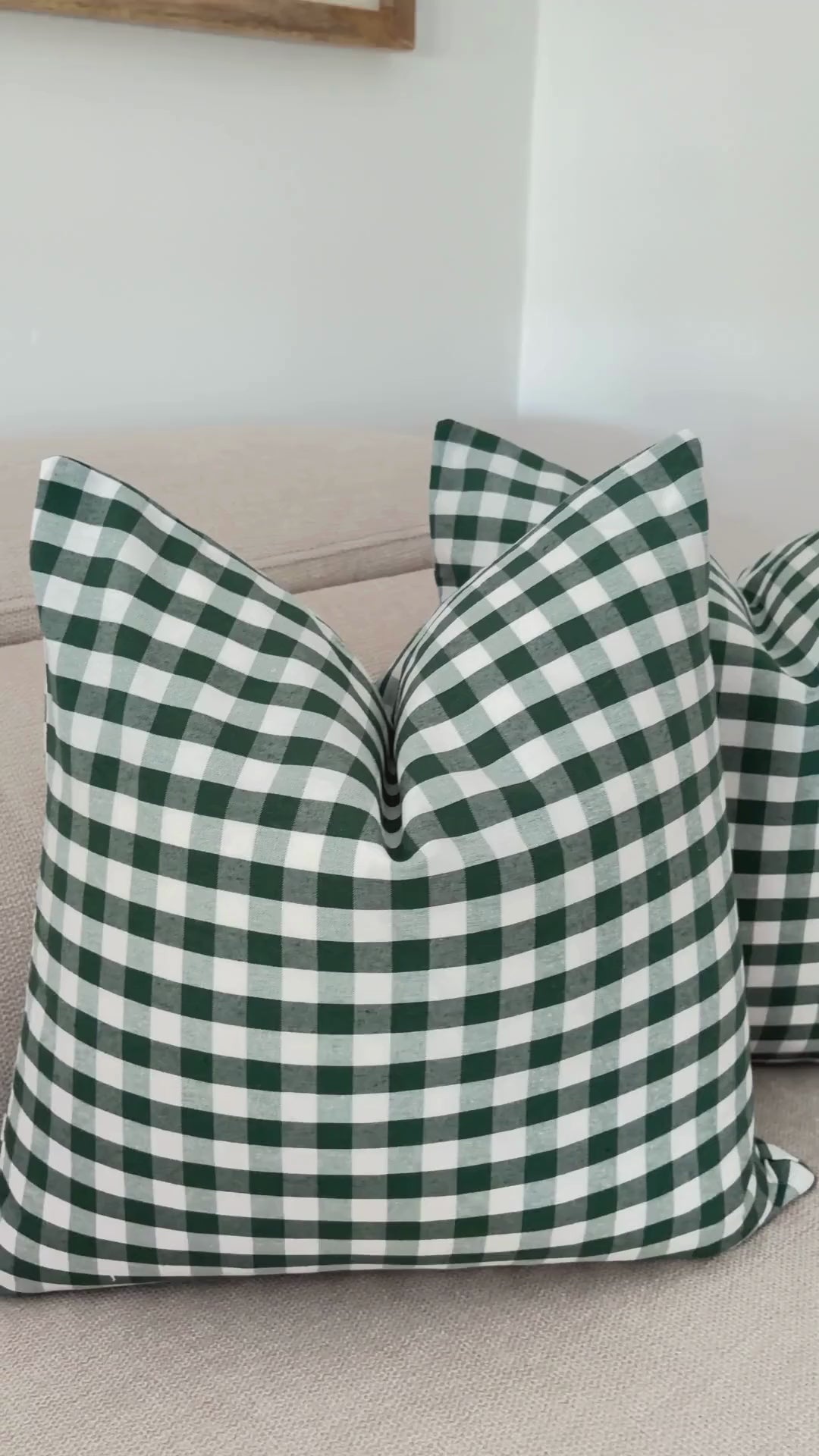 Demonstration of splash-proof water repellent finish on perfect Christmas green gingham cushion cover.