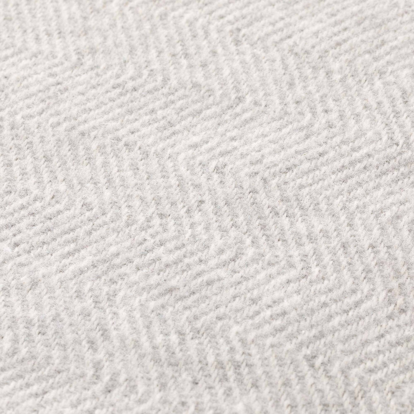 Close-up of the breathable and soft natural cotton fabric texture of the NATURE collection blanket.