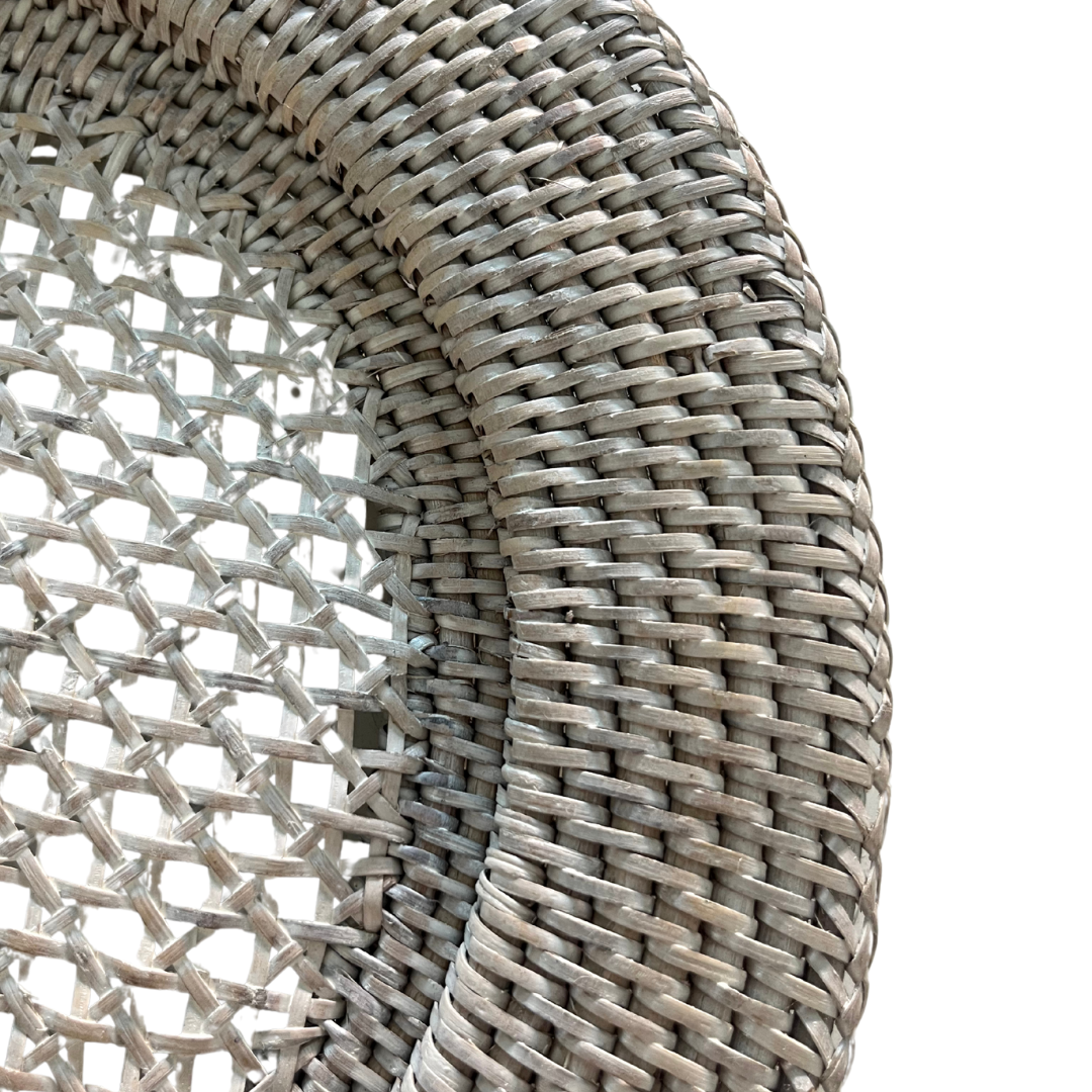 Close-up of eco-friendly handwoven rattan texture in deep white finish